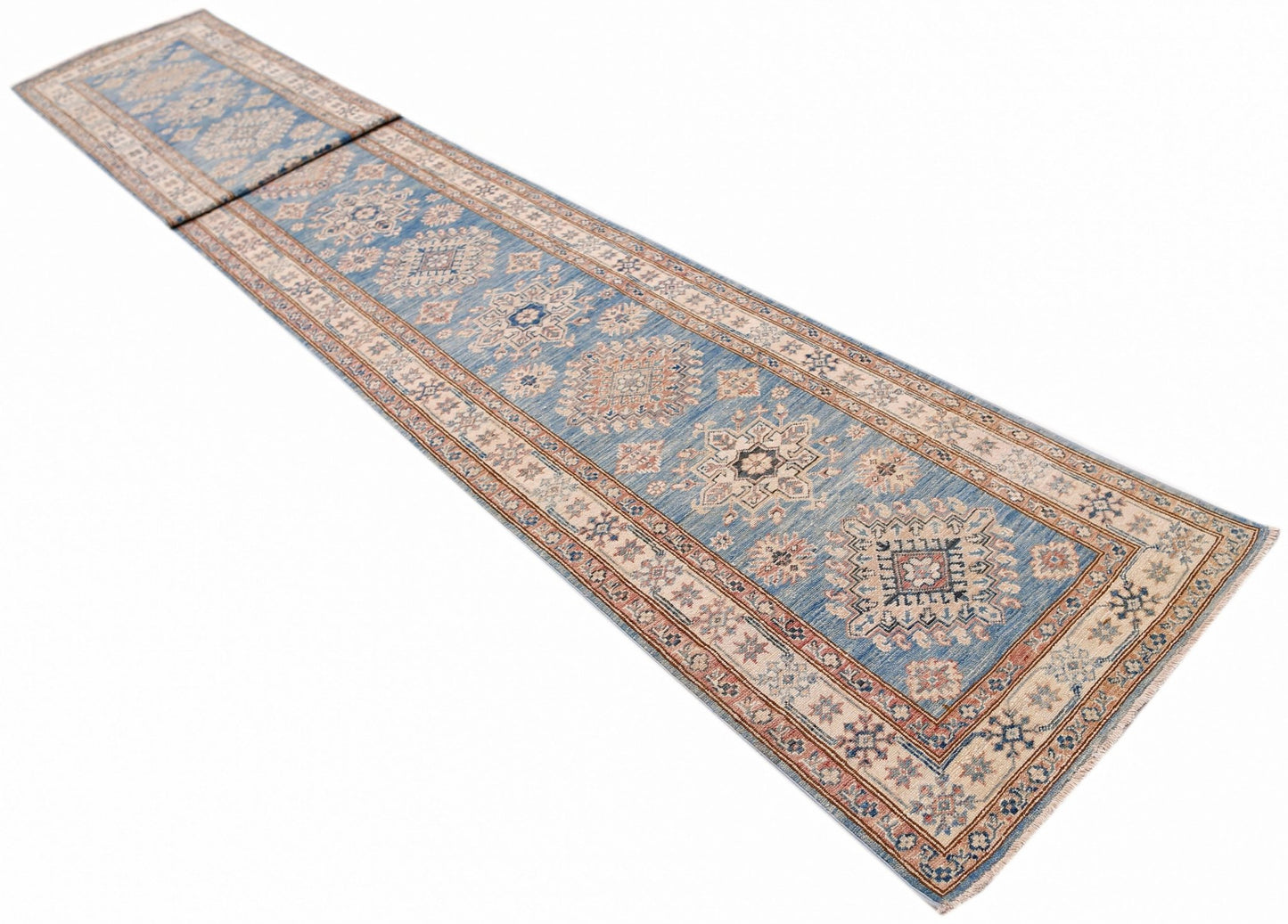 A long, handmade Afghan Super Kazakh runner rug featuring traditional blue and beige geometric motifs.
