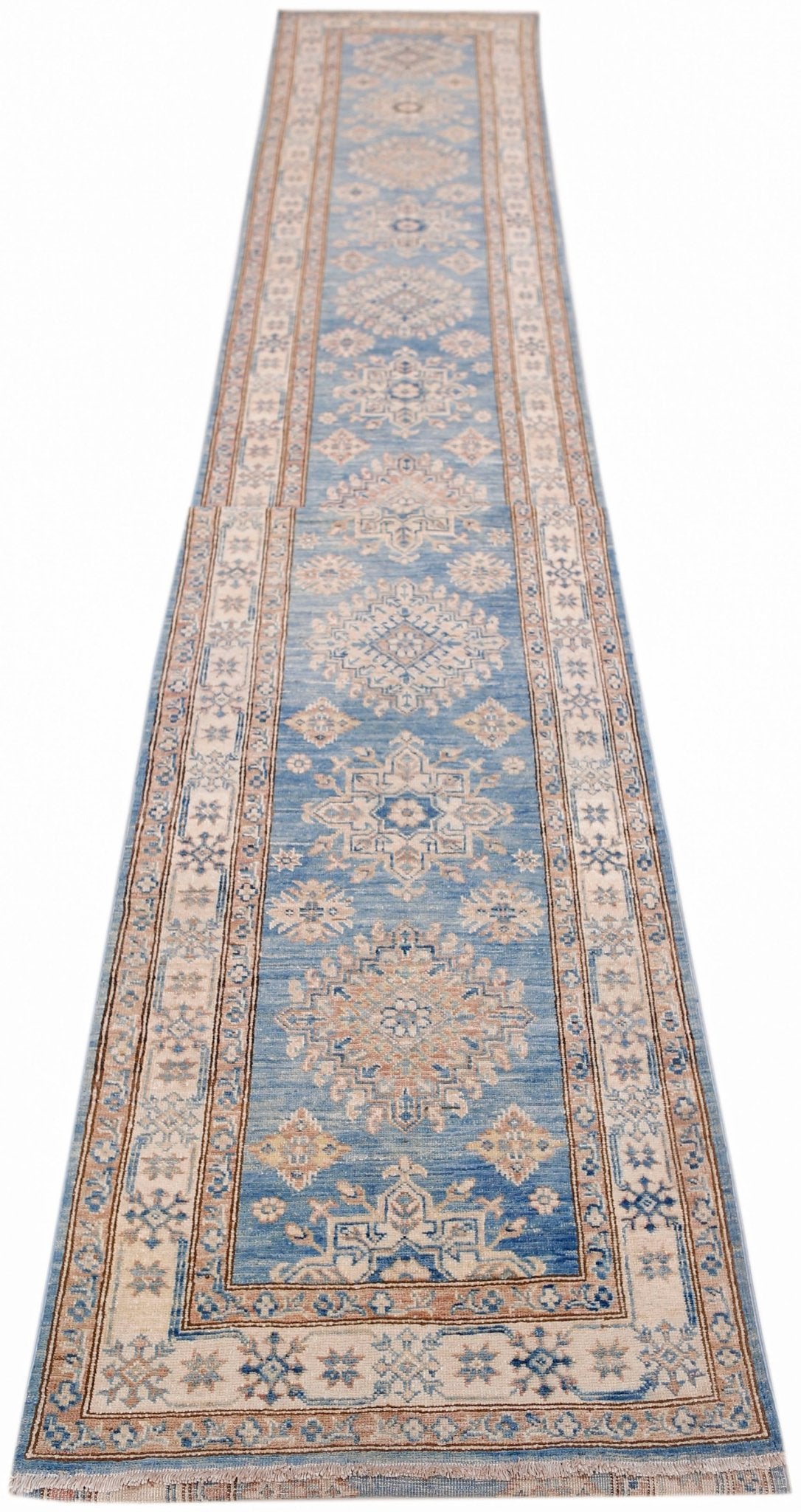 An Afghan Super Kazakh runner rug featuring traditional geometric motifs in blue and beige tones.