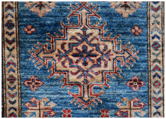 Handmade Afghan Super Kazakh runner featuring a traditional geometric medallion on a blue field.