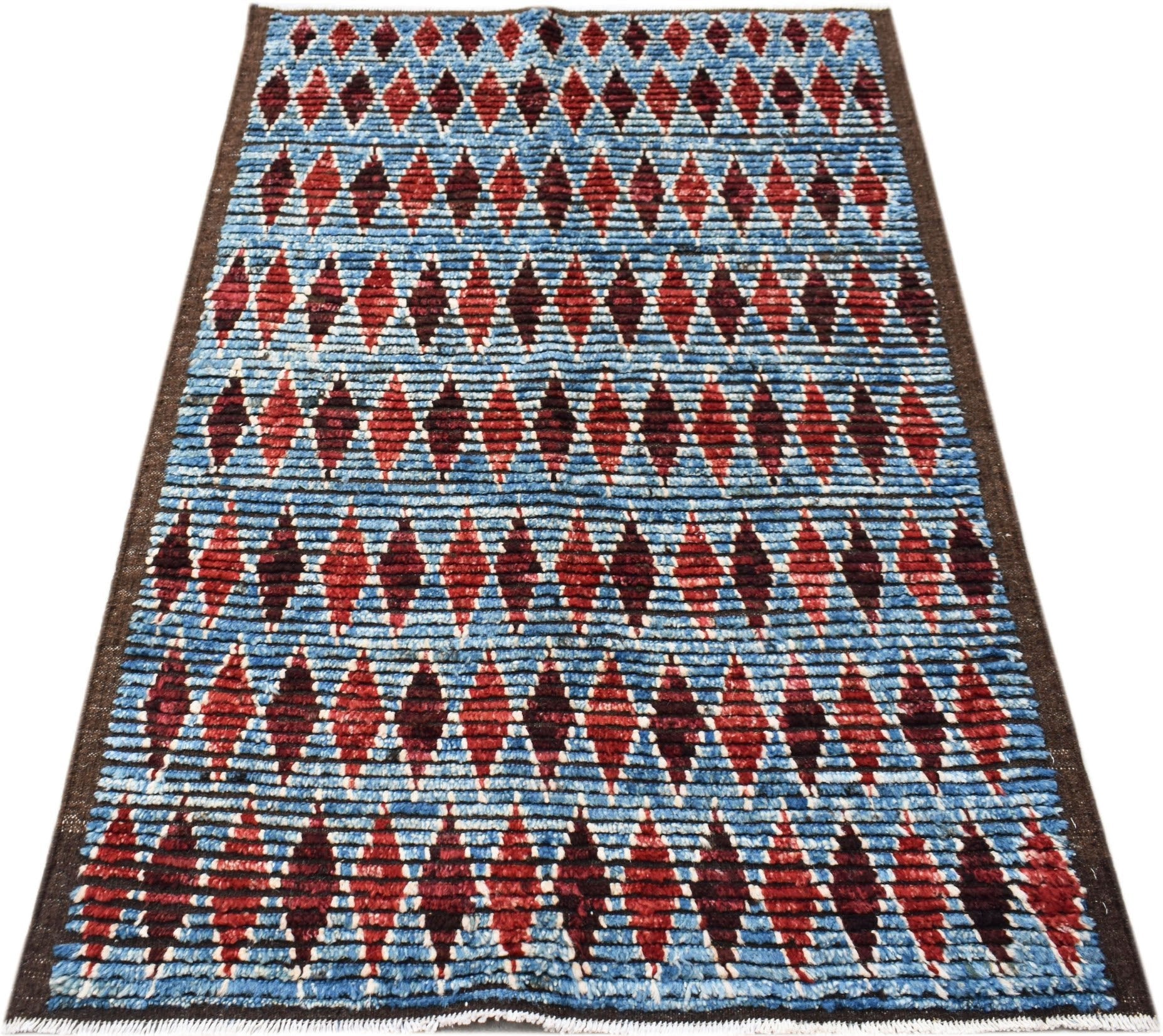 Hand-knotted Afghan Yekta rug featuring a blue background with a repeating red diamond pattern.