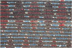 A close-up of a hand-knotted Afghan rug featuring horizontal stripes in blue, red, and cream.