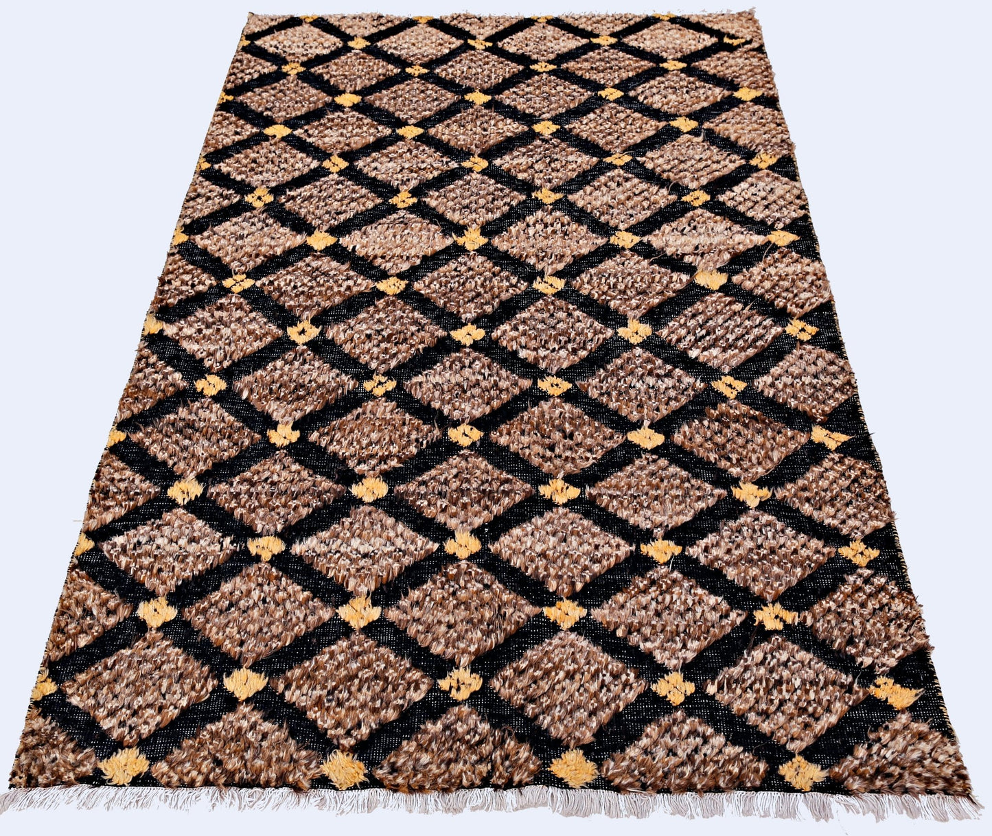 An Afghan Yekta rug featuring a brown and black diamond pattern with yellow accents and fringe.