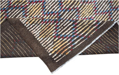 A hand-knotted Afghan wool rug featuring a dark brown base with colorful striped patterns.