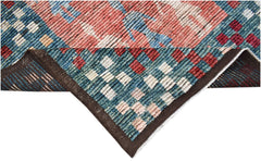 A hand-knotted Afghan Yekta rug featuring a geometric pattern in blue, red, and cream wool.