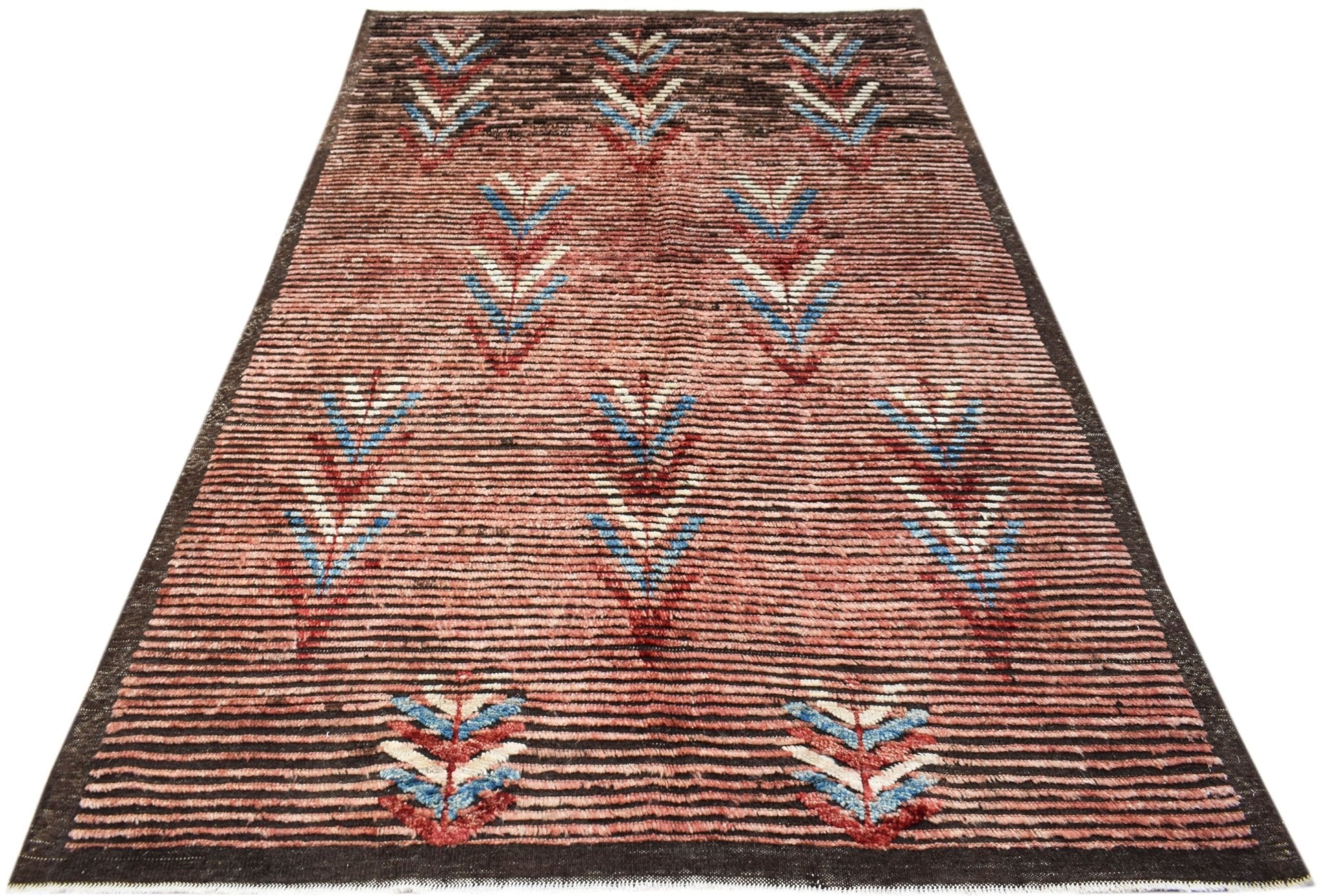 An Afghan Yekta rug featuring a striped reddish-brown background with geometric leaf patterns.
