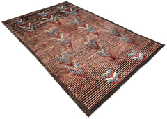 An Afghan Yekta rug featuring a reddish-brown striped field with repeating geometric arrow motifs.