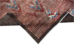 A hand-knotted Afghan Yekta rug featuring a striped pattern in red, black, and blue tones.