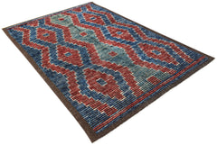 An Afghan Yekta rug featuring a geometric pattern in shades of red, blue, and teal.