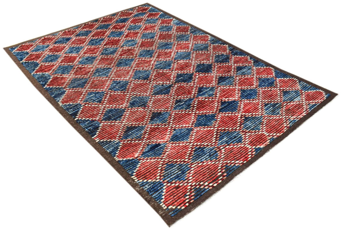 An Afghan Yekta rug featuring a red and blue diamond pattern with a dark brown border.