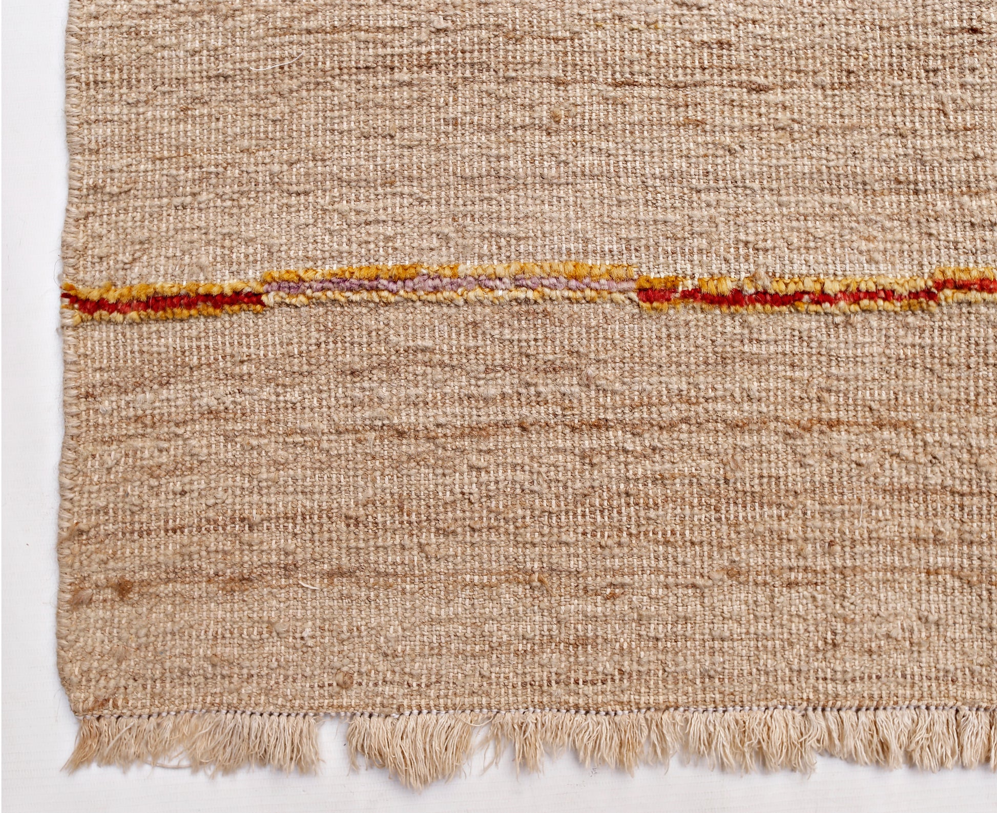 A handmade Afghan Yekta rug featuring a textured beige wool weave with a horizontal striped accent.