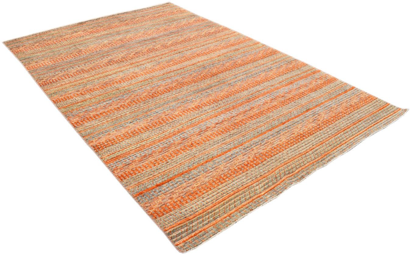 An Afghan Yekta rug featuring a textured, striped pattern in shades of orange and grey.