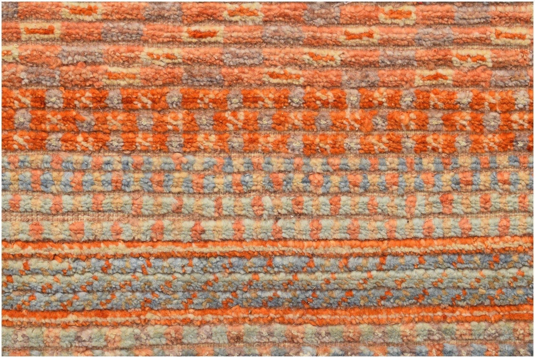 A handmade Afghan Yekta rug featuring a textured, horizontal striped pattern in orange and grey.