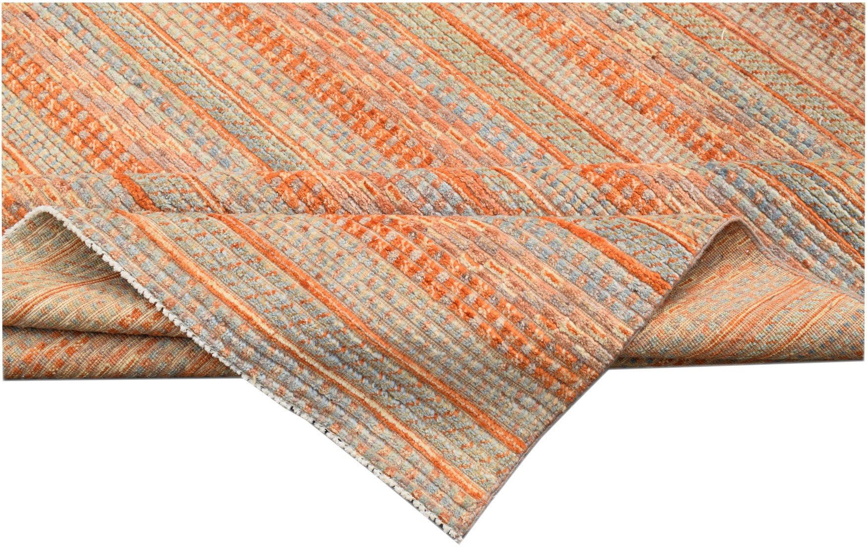 A handmade Afghan Yekta rug featuring a textured, striped pattern in shades of orange and blue.