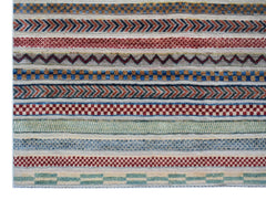 Handmade Afghan Yekta rug featuring a series of colorful, textured geometric and striped patterns.