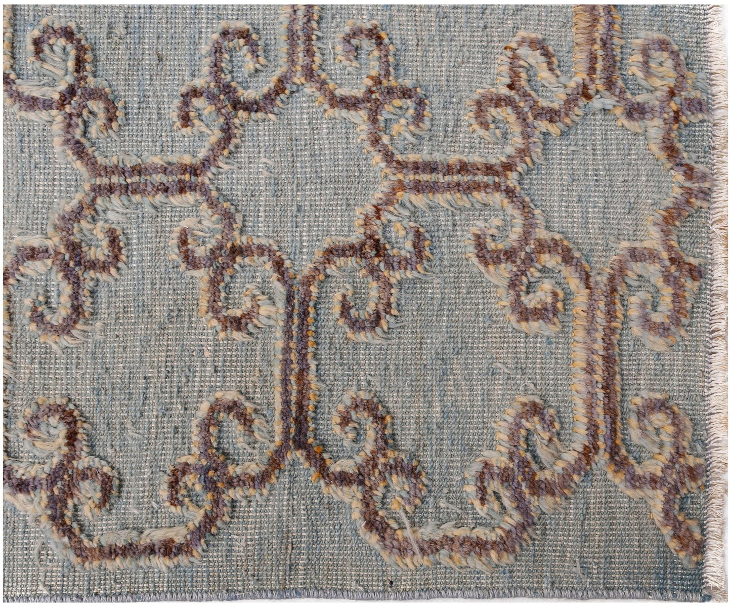 An Afghan Yekta rug featuring a textured, hand-knotted pattern in blue and earthy brown tones.