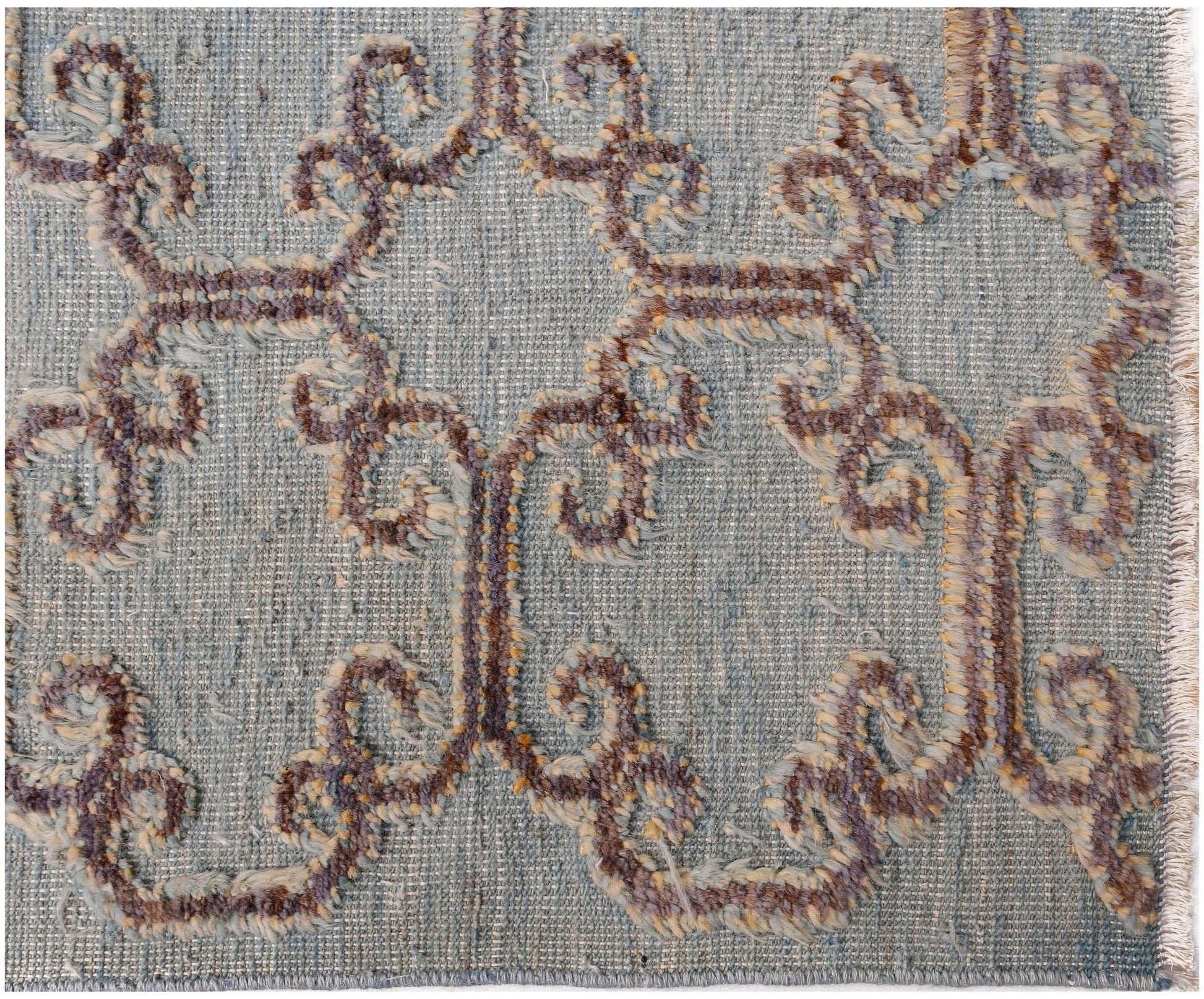 An Afghan Yekta rug featuring a textured, hand-knotted pattern in blue and earthy brown tones.