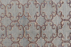 An Afghan Yekta rug featuring a textured, light blue geometric pattern with raised purple details.