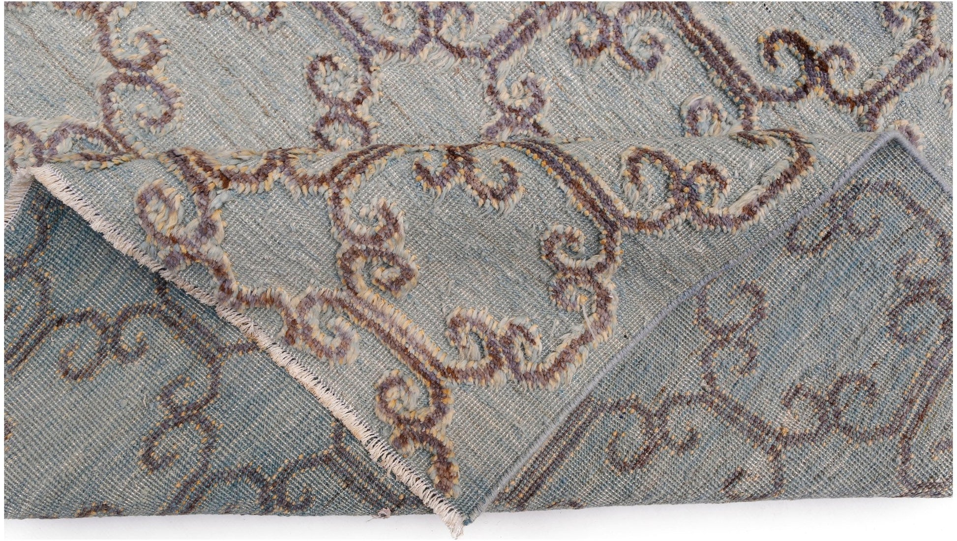An Afghan Yekta rug featuring a blue field with raised, textured brown and cream scroll patterns.