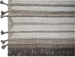 An Afghan Yekta rug featuring alternating textured cream wool stripes and brown kilim bands.