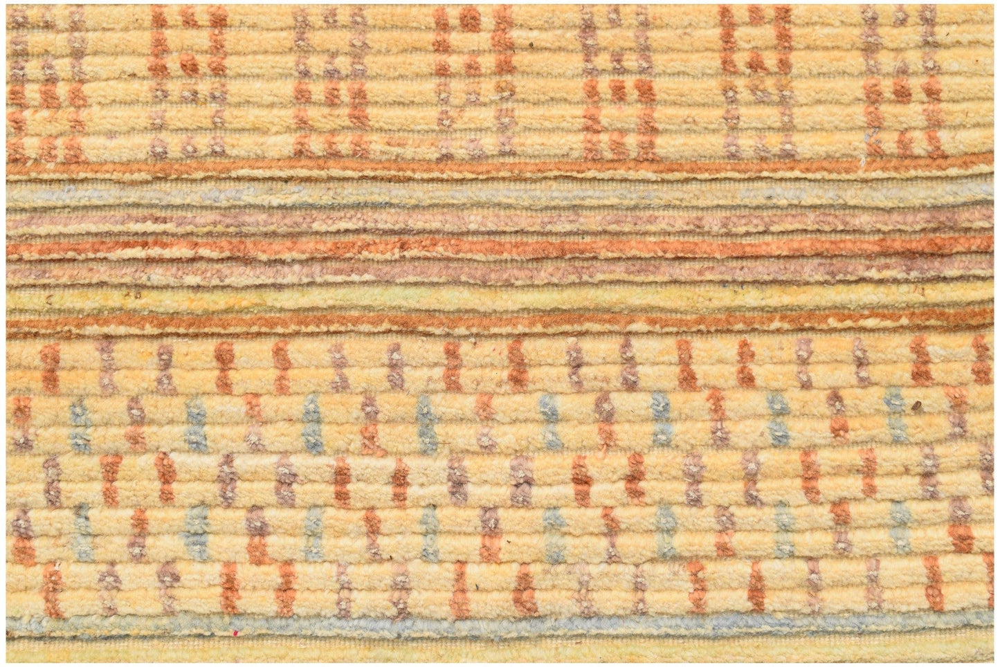 A handmade Afghan Yekta rug featuring a textured, striped pattern in shades of yellow and orange.