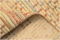 A handmade Afghan Yekta rug featuring a textured, striped pattern in warm earth tones.