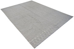 An Afghan Yekta rug featuring a textured, light-colored geometric pattern on a handspun wool base.