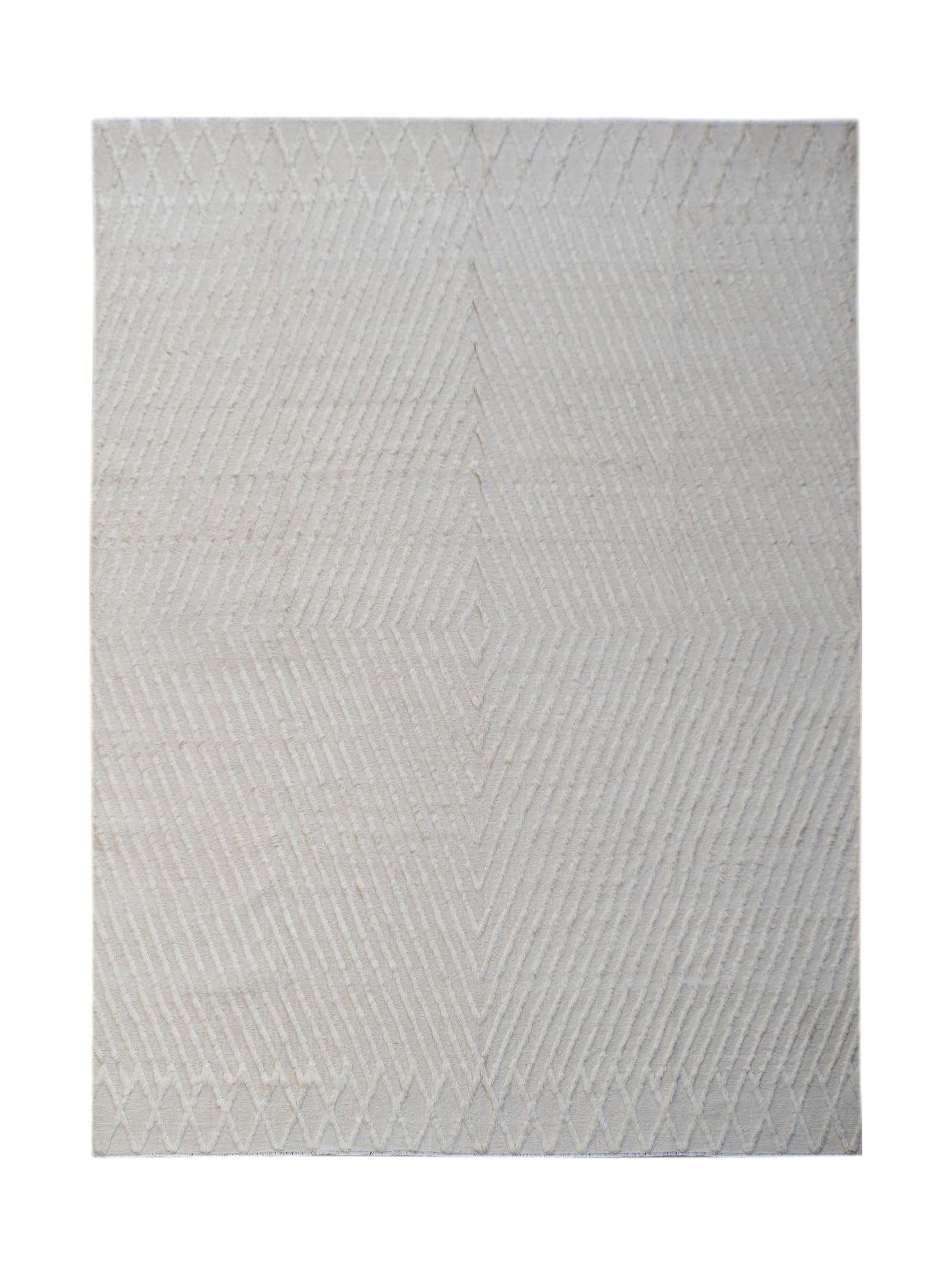 An Afghan Yekta rug featuring a textured, cream-colored geometric diamond pattern.