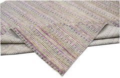 An Afghan Yekta rug featuring a textured, striped pattern in shades of beige, purple, and grey.