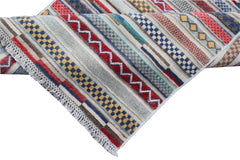 Handmade Afghan Yekta runner rug featuring a colorful geometric pattern with stripes and tassels.
