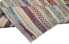 A handmade Afghan runner rug featuring a cream background with colorful geometric striped patterns.