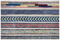 Handmade Afghan runner rug featuring a series of colorful, patterned horizontal bands.