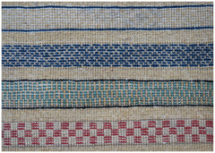An Afghan Yekta runner featuring horizontal stripes in blue, green, and red on a tan wool base.