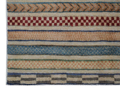 Handmade Afghan runner rug featuring horizontal bands of geometric patterns in earthy tones.