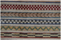 An Afghan Yekta runner featuring horizontal bands of geometric patterns in wool on a cotton base.
