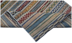 Handmade Afghan Yekta runner featuring a striped pattern with varied textures and earthy colors.