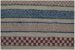 A handmade Afghan runner featuring horizontal stripes in red, blue, and tan wool.