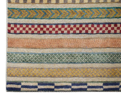 Handmade Afghan runner rug featuring horizontal bands of geometric patterns in vibrant colors.