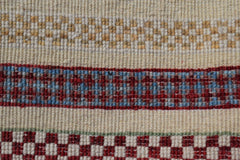 Afghan Yekta Runner with geometric patterns in red, blue, and beige.
