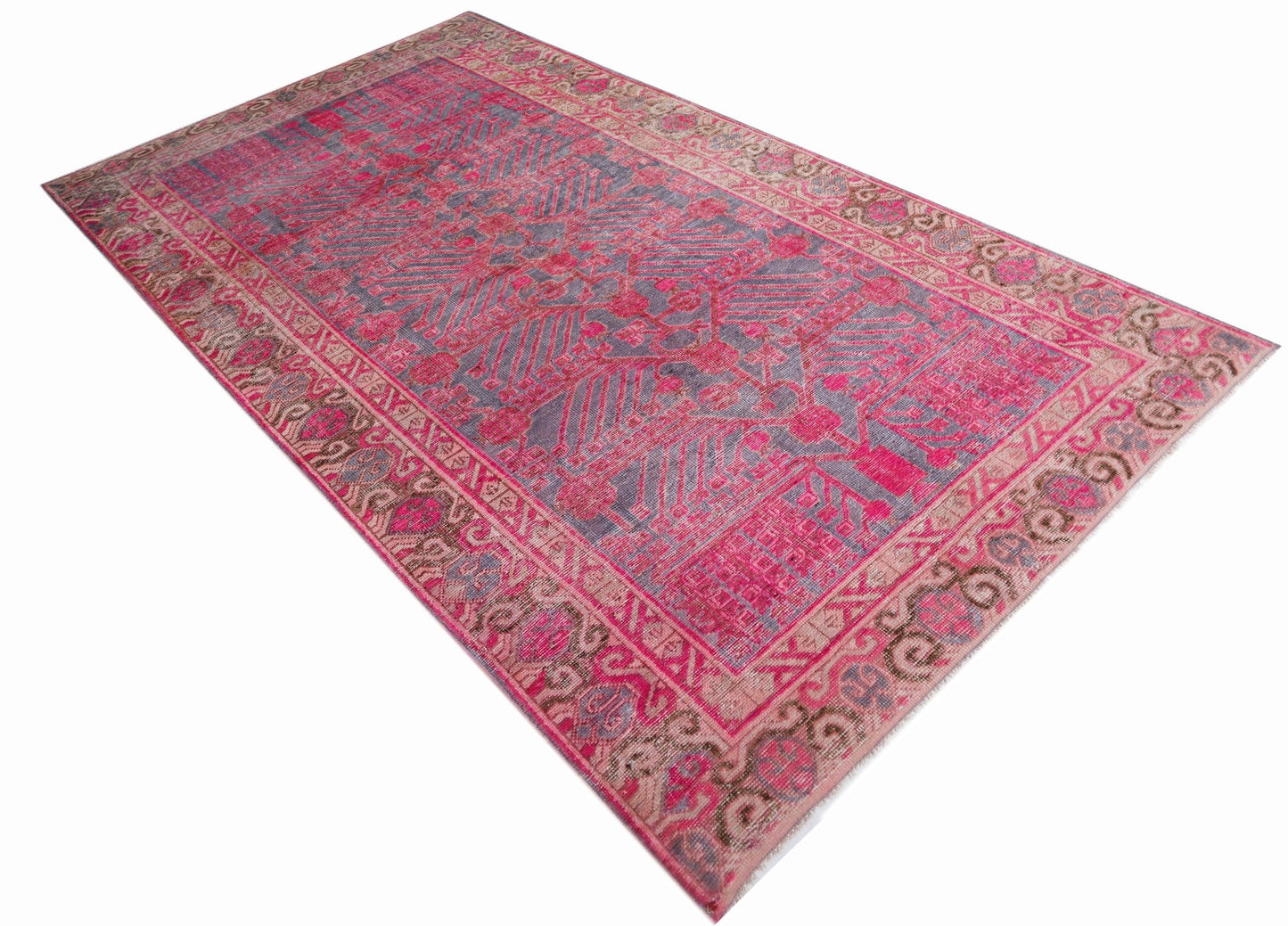 An antique handwoven Chinese Khotan rug featuring an intricate pomegranate pattern in vibrant pink.