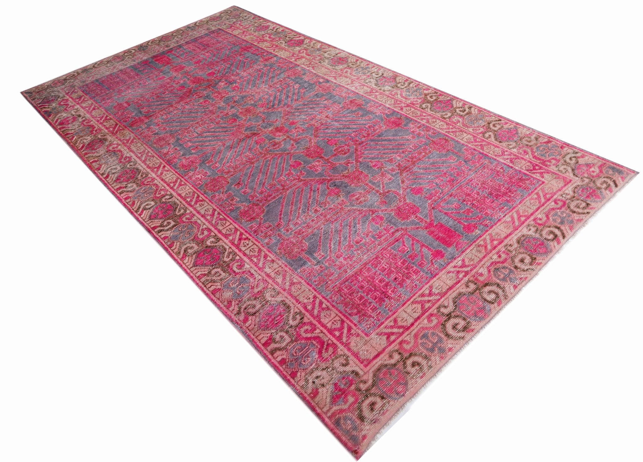 An antique handwoven Chinese Khotan rug featuring an intricate pomegranate pattern in vibrant pink.
