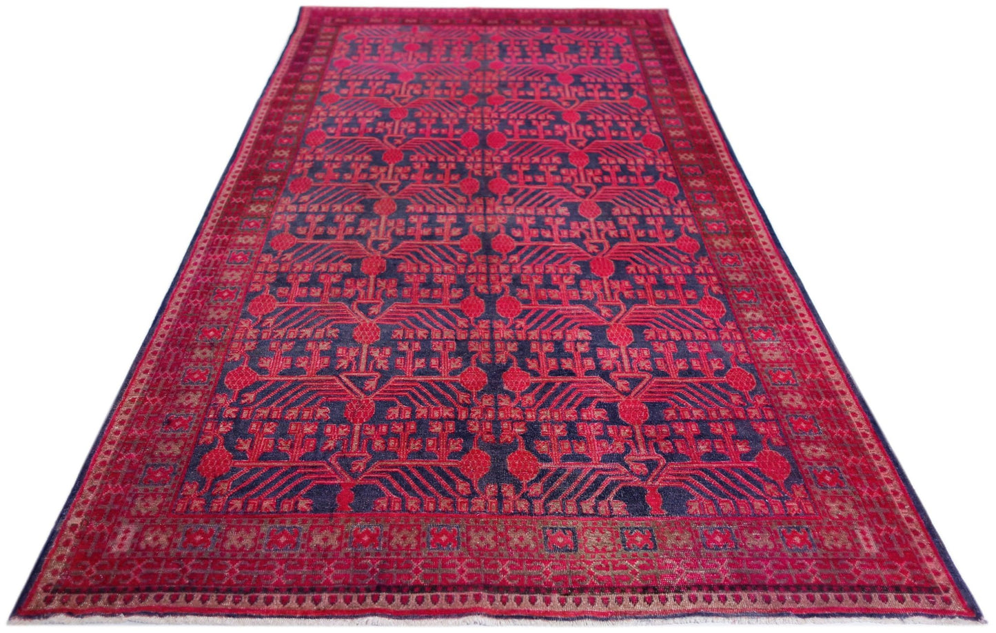 An antique handwoven Khotan rug featuring an intricate pomegranate pattern in vibrant pink.