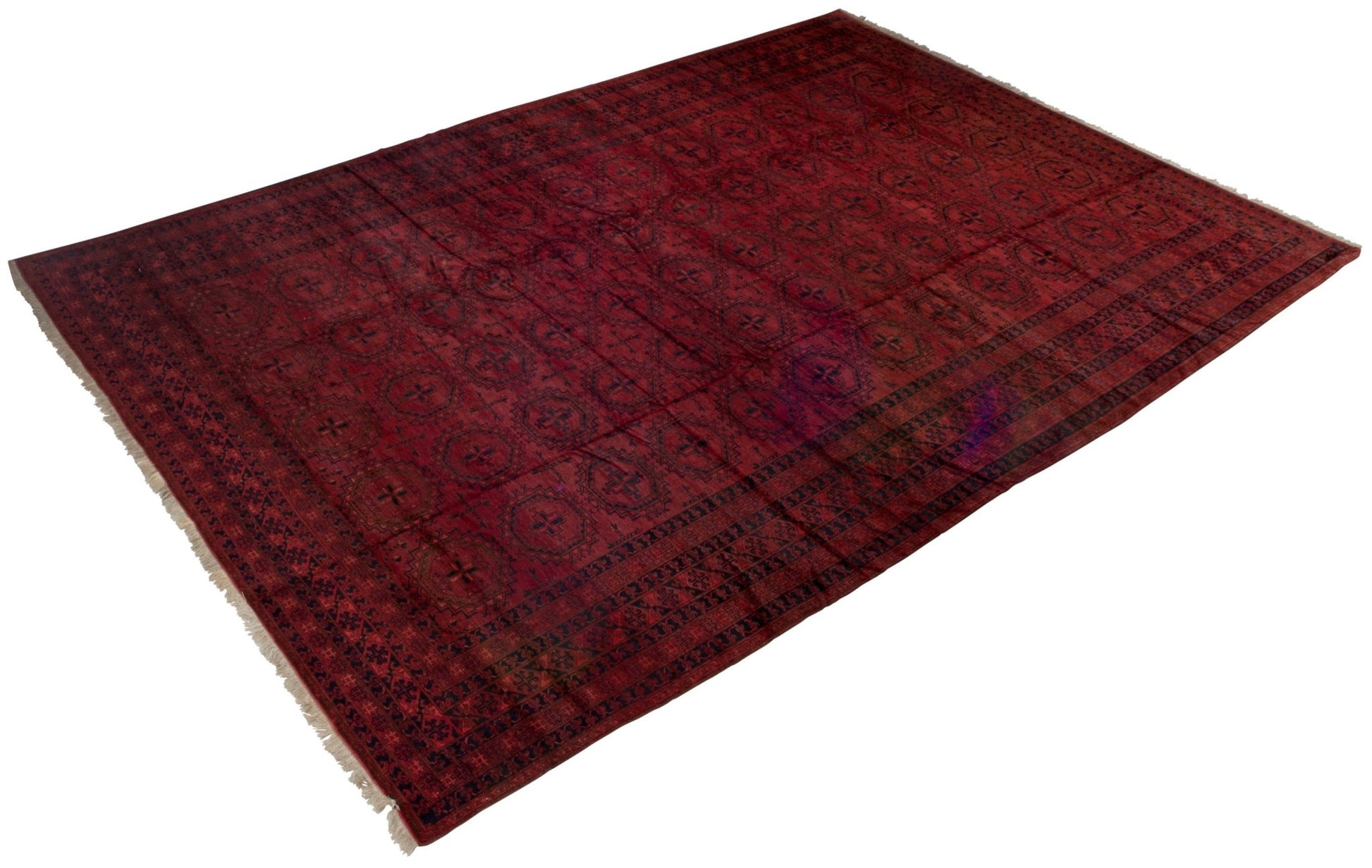 An antique Afghan Turkmen rug featuring a deep red field with repeating geometric motifs.