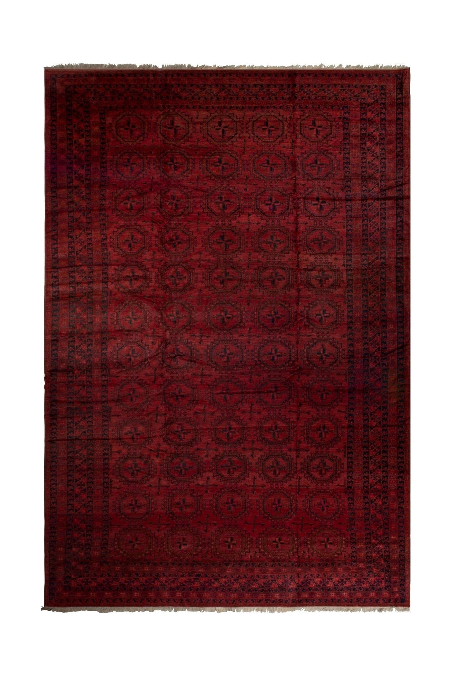An antique Afghan Turkmen rug featuring a deep red field with repeating geometric motifs.