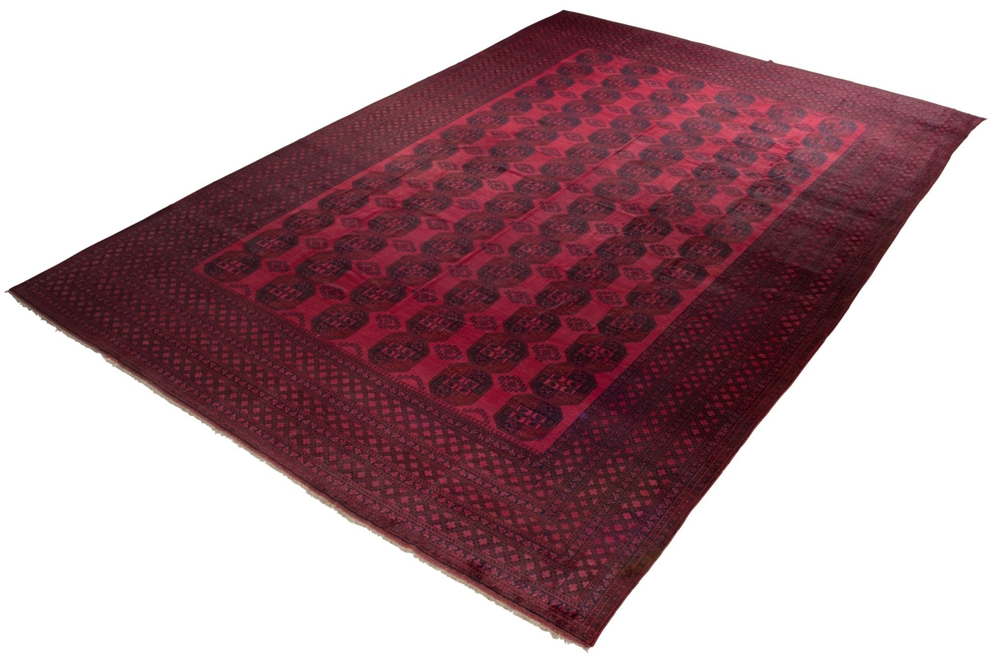 An antique Afghan Turkmen rug featuring a repeating geometric pattern in deep red and black tones.