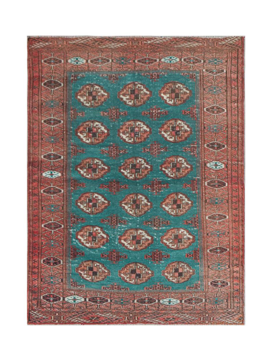 Vintage Afghan Turkmen rug with a teal field and geometric patterns.