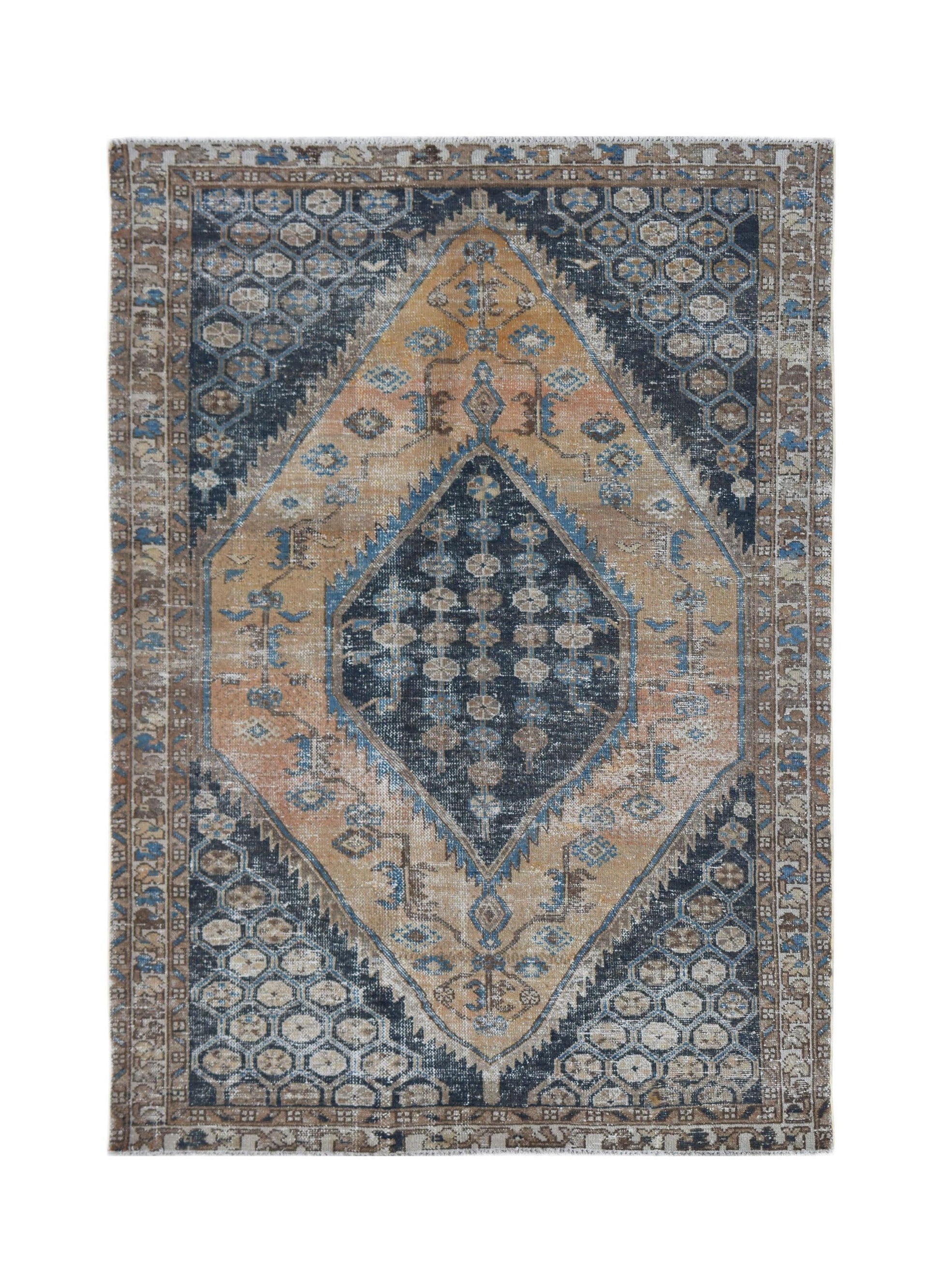 A vintage Persian rug featuring a central diamond medallion in shades of blue, tan, and brown.
