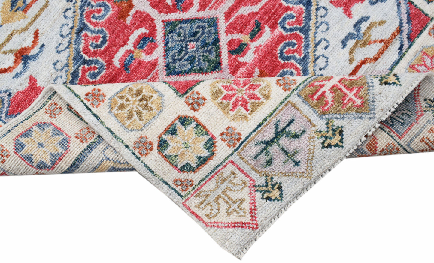 A handwoven transitional Oushak runner featuring a colorful floral pattern on a cream background.