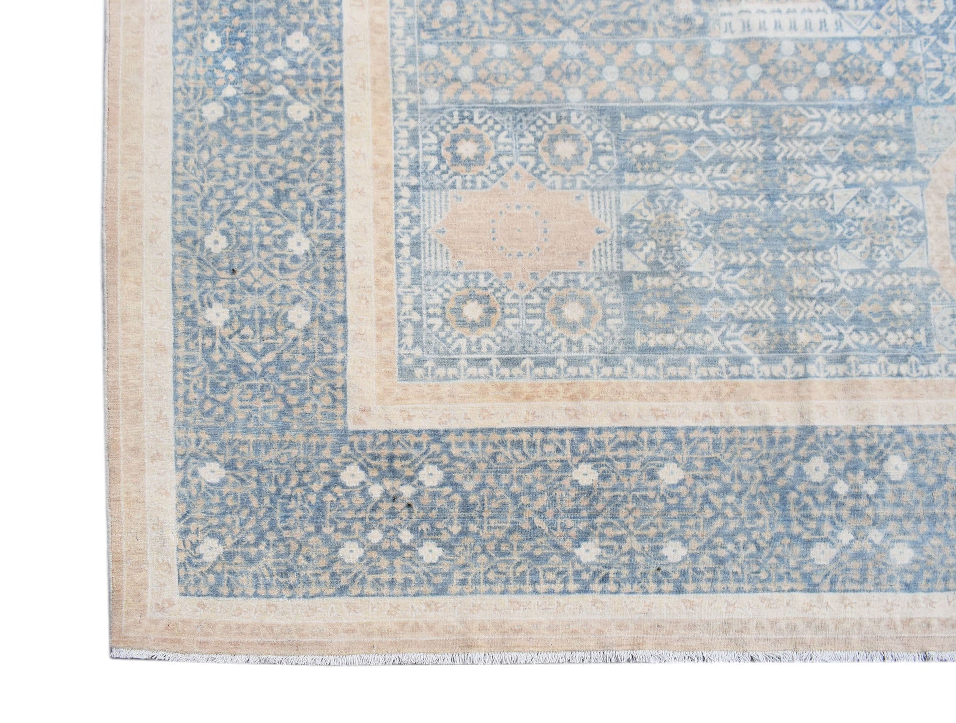 A handwoven Afghan Balkh rug featuring a traditional blue and beige Mamluk medallion pattern.