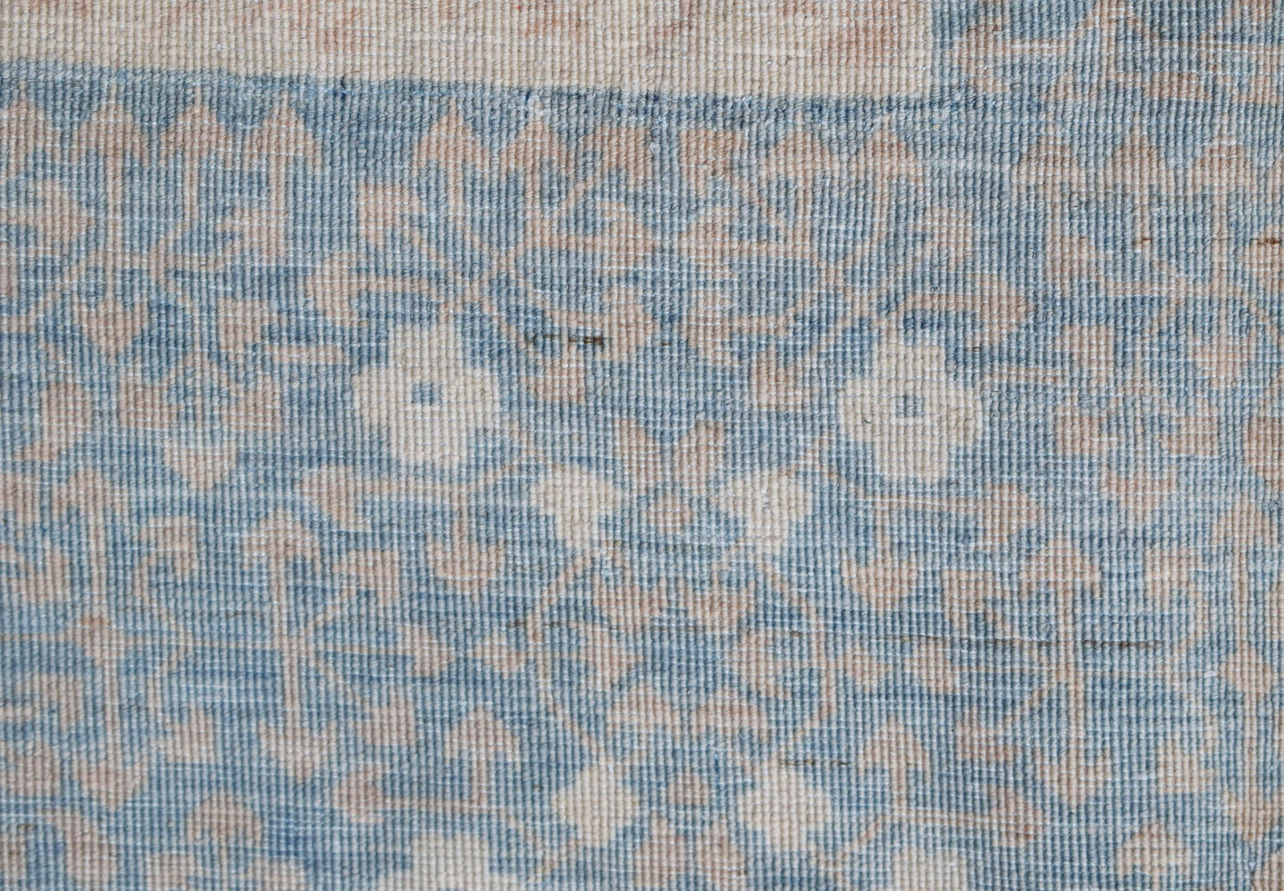 A handwoven Afghan Balkh rug featuring a traditional blue and beige Mamluk geometric pattern.