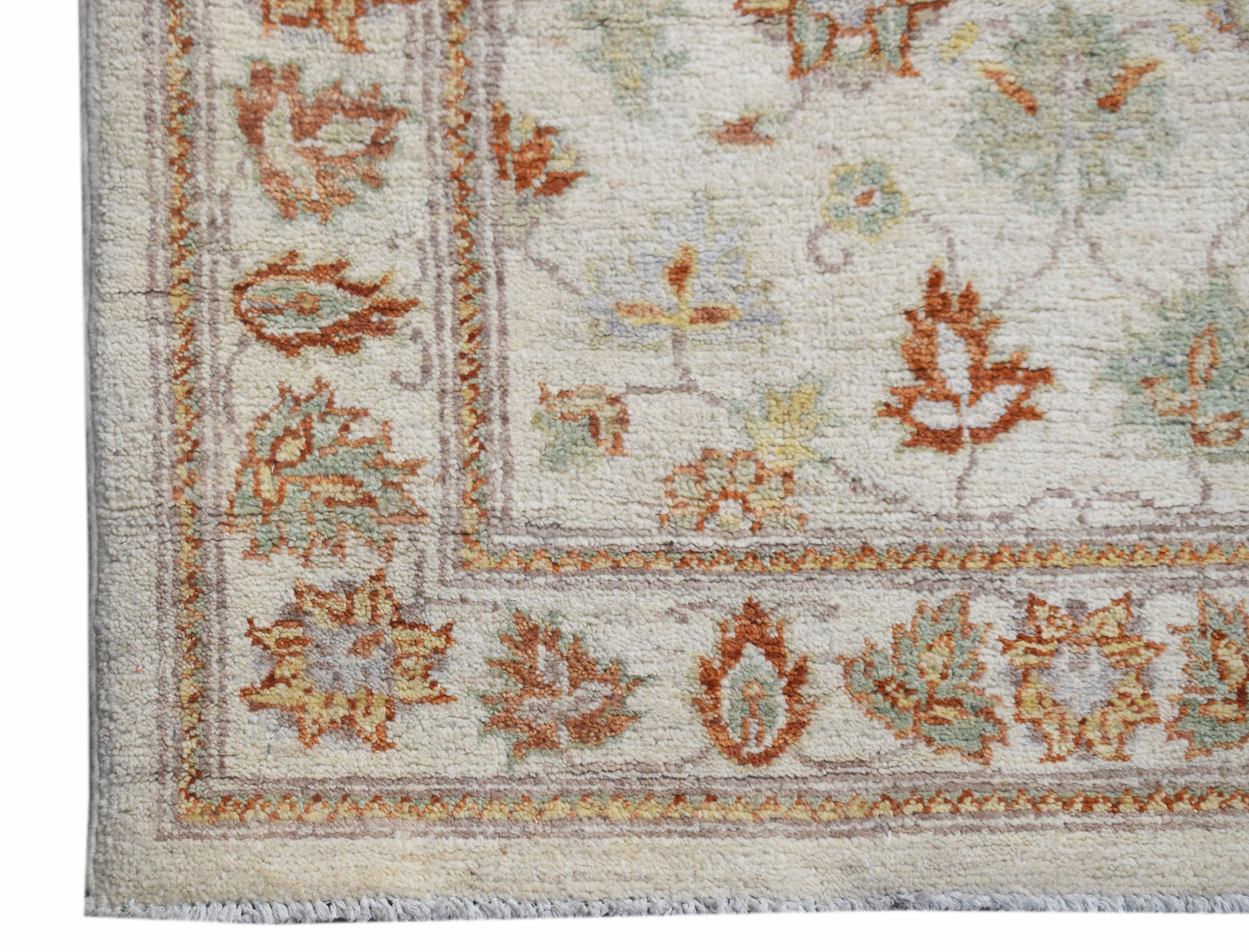 A handwoven Afghan Chobi runner featuring a traditional floral pattern in earthy wood tones.